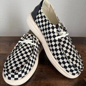 Corky’s Black and Off-White Checkered Kayaks